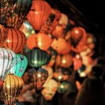 Colorful lanterns illuminating the night at a traditional festival celebration.