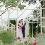 Couple embracing in a garden during an engagement photo shoot in Davao City.